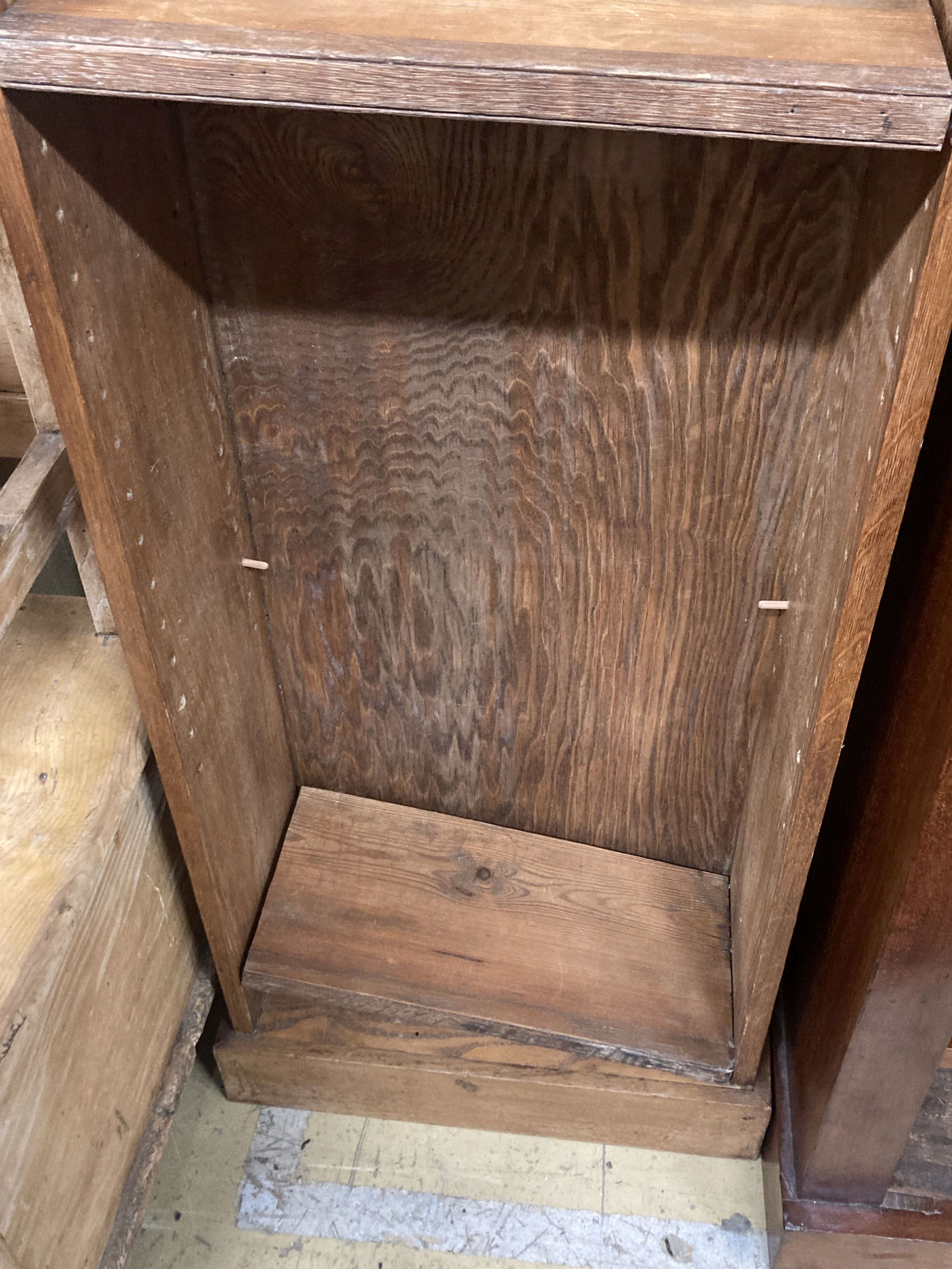 A narrow oak and pine open bookcase, length 49cm, depth 23cm, height 176cm